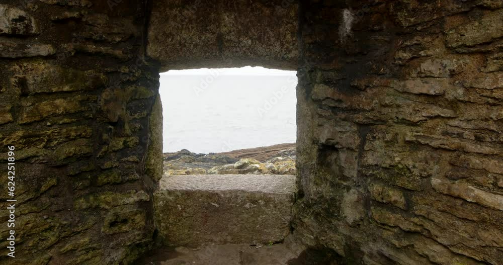 Looking though Window opening at Castle Fort, Falmouth with Sea in the background Looking though Window opening at Castle Fort, Falmouth with Sea in the background