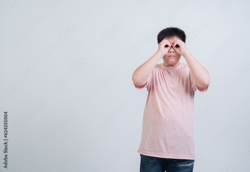 boy on white background, child holding hand to eye boy on white background, child holding hand to eye