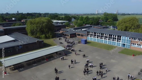 Drone shot 50fps. Birds eye view of secondary, academy school playground. School children, school yard. Filmed East Yorkshire. UK.