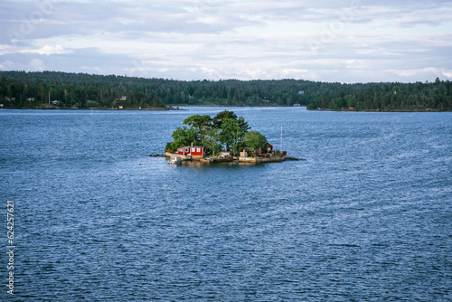 Photography Typical red timber house on an islands of the Stockholm Archipelago in Sweden
