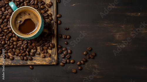 A mug of coffee and beans on an old table. Top view with copy space