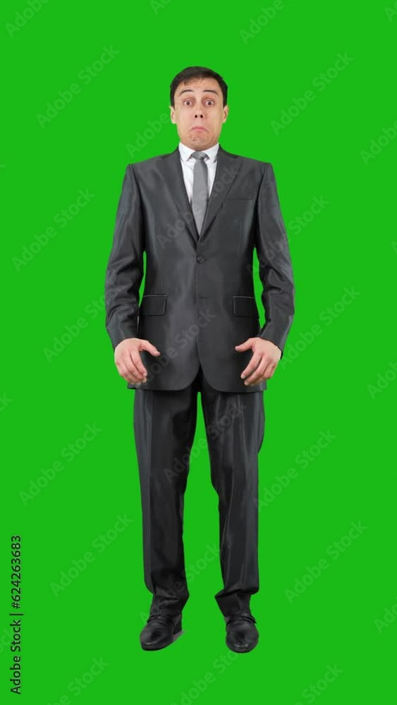 Surprised male employee looking at camera in chroma key Surprised male employee looking at camera in chroma key
