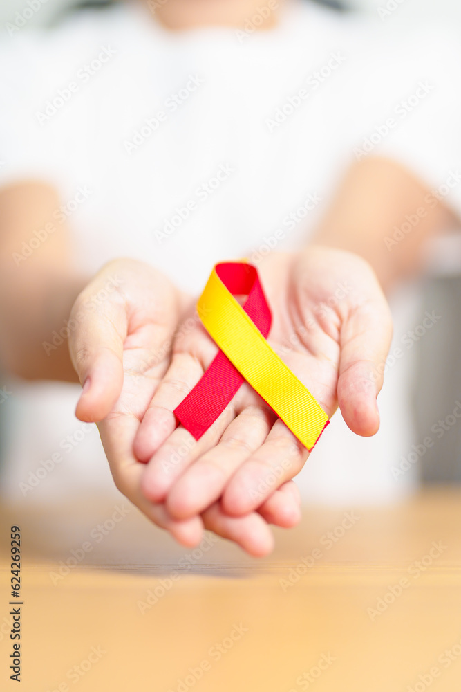 woman holding Red and Yellow ribbon. World hepatitis day awareness month, 28 July, Liver cancer, Jaundice, Cirrhosis, Failure, Enlarged, Hepatic Encephalopathy and Health concept woman holding Red and Yellow ribbon. World hepatitis day awareness month, 28 July, Liver cancer, Jaundice, Cirrhosis, Failure, Enlarged, Hepatic Encephalopathy and Health concept