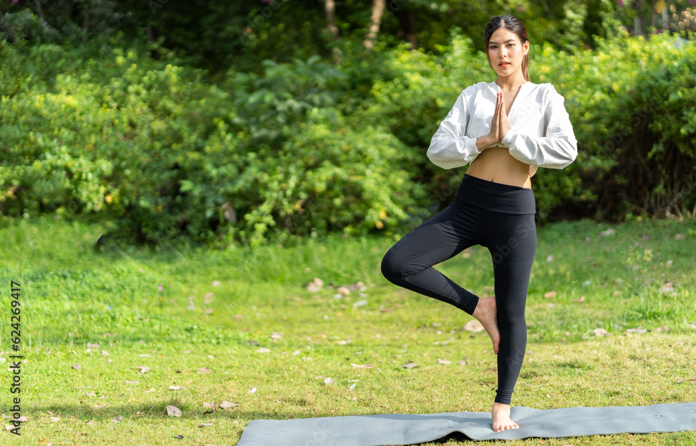 Portrait of sport slim fit strength woman training in sportswear sitting relax and practicing yoga, fitness, exercise, wellness, workout, sport at park.Diet concept.Fitness and healthy lifestyle Portrait of sport slim fit strength woman training in sportswear sitting relax and practicing yoga, fitness, exercise, wellness, workout, sport at park.Diet concept.Fitness and healthy lifestyle