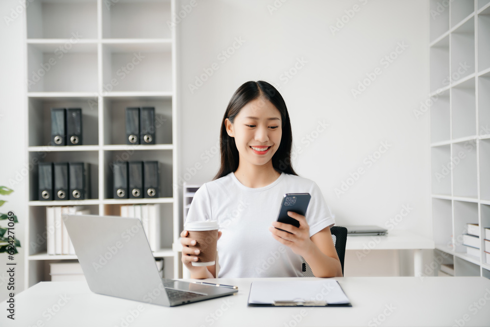 Business woman using tablet and laptop for doing math finance on an office desk, tax, report, accounting, statistics, and analytical research concept in office Business woman using tablet and laptop for doing math finance on an office desk, tax, report, accounting, statistics, and analytical research concept in office