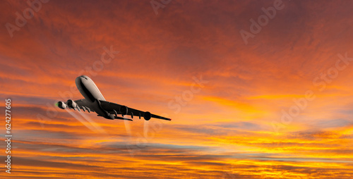 Passenger commercial aircraft flying above the clouds in sunset light.