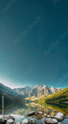 Fototapeta Naklejka Na Ścianę i Meble -  Tatra National Park, Poland. Famous Mountains Lake Morskie Oko Or Sea Eye Lake In Summer Morning. Five Lakes Valley. Beautiful Scenic View. European Nature. UNESCO's World Network of Biosphere