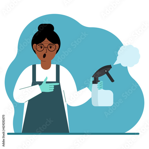 A woman in gloves holds a spray bottle with disinfectant liquid, antiseptic or detergent. Home disinfection and hygiene.