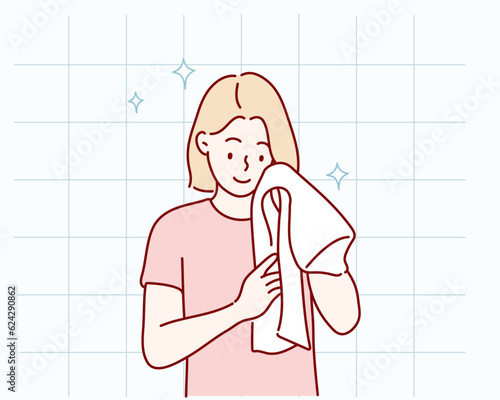 Washing face. Closeup of woman cleaning skin with towel. Hand drawn style vector design illustrations.