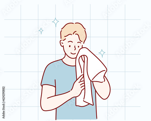 Washing face. Closeup of man cleaning skin with towel. Hand drawn style vector design illustrations.