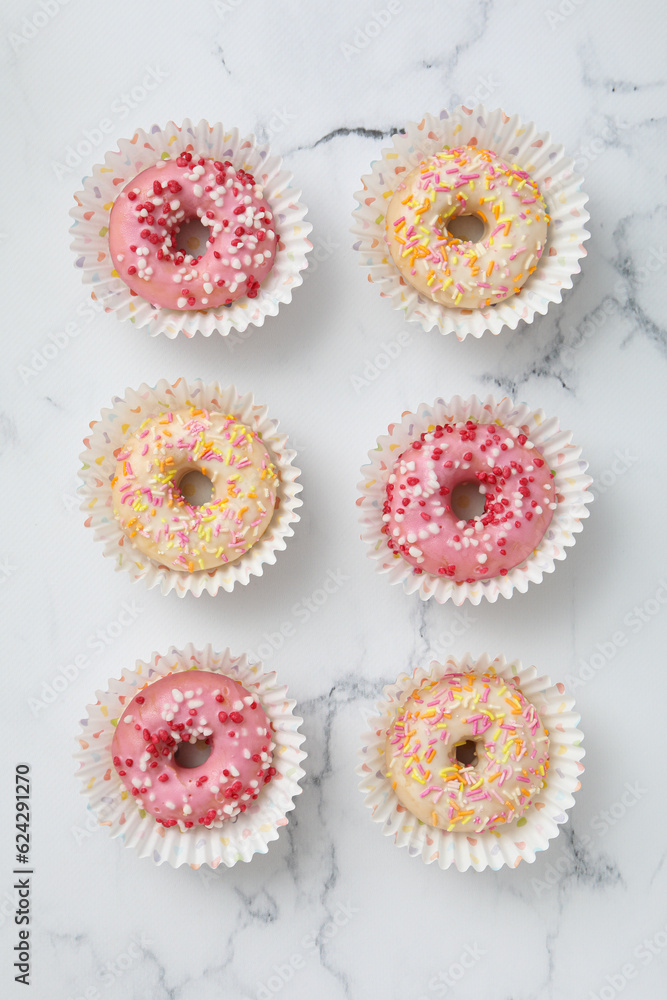 Glazed donuts on marble background, top view Glazed donuts on marble background, top view
