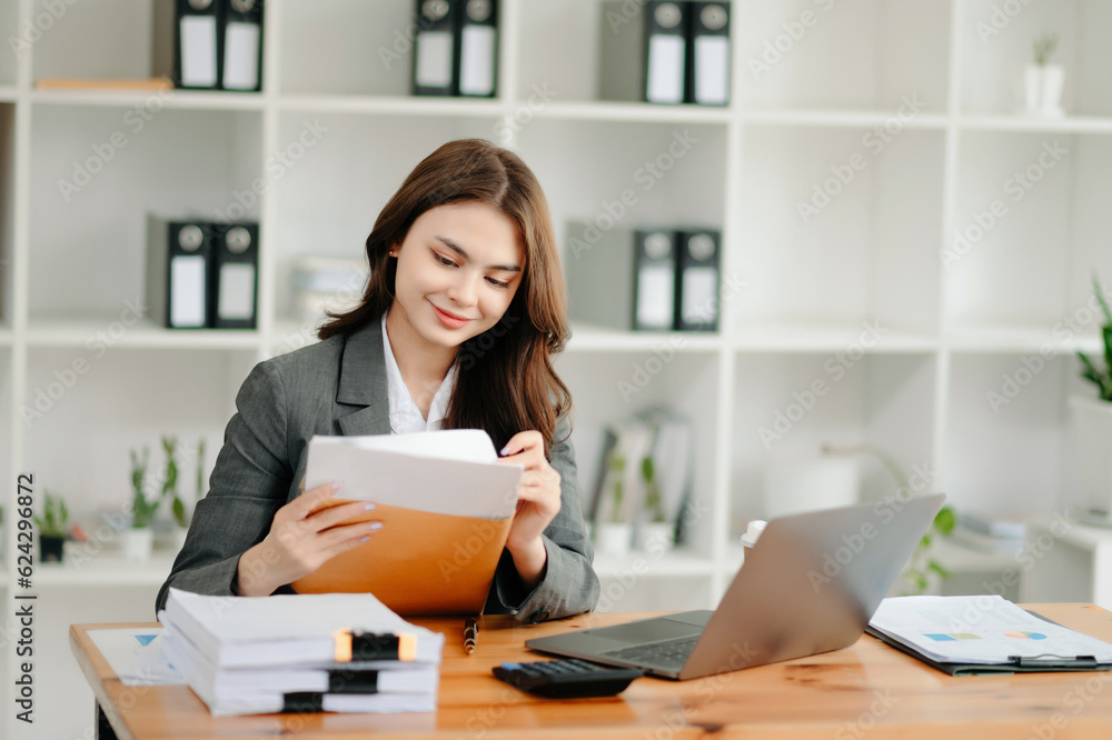 Woman freelancer is working her job on computer tablet and laptop Doing accounting analysis report real estate investment data, Financial at office. Woman freelancer is working her job on computer tablet and laptop Doing accounting analysis report real estate investment data, Financial at office.