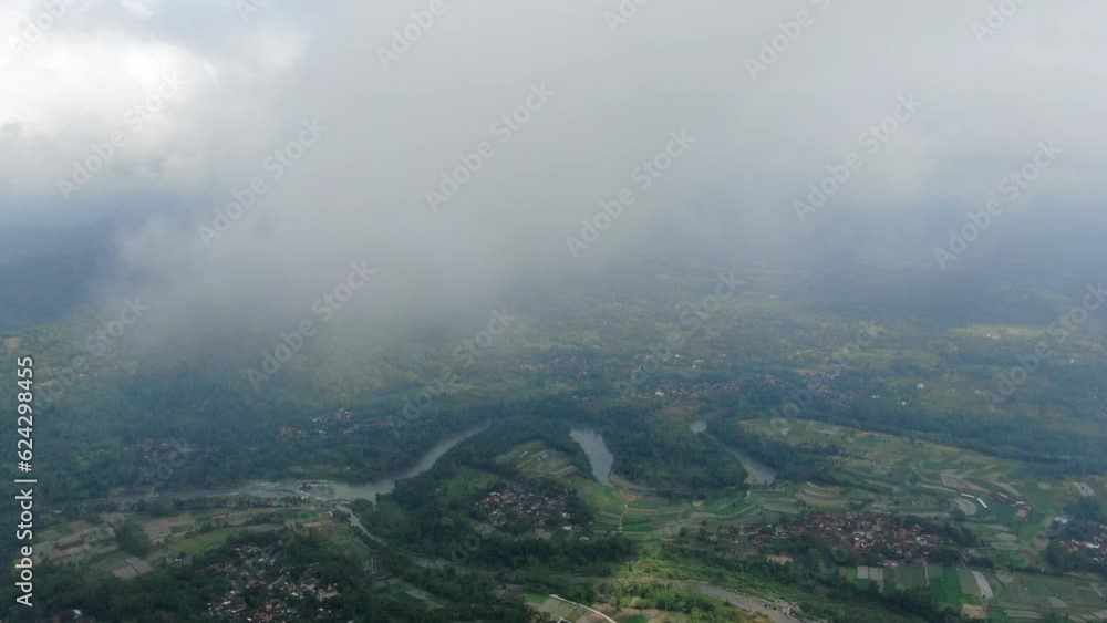 Flying above clouds over Central Java landscape Flying above clouds over Central Java landscape
