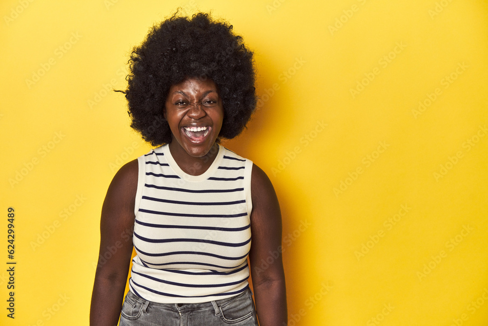 African-American woman with afro, studio yellow background shouting very angry, rage concept, frustrated. African-American woman with afro, studio yellow background shouting very angry, rage concept, frustrated.