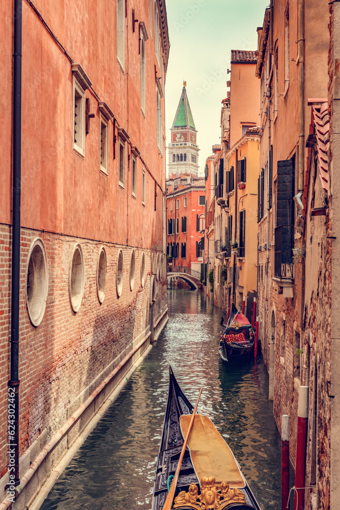 Gondola on scenic canal in Venice, Italy.