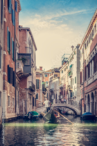 Canal in Venice  Italy with gondolier rowing gondola