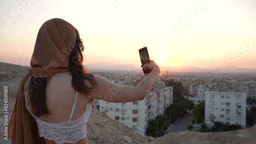 woman with tablet computer on the beach
