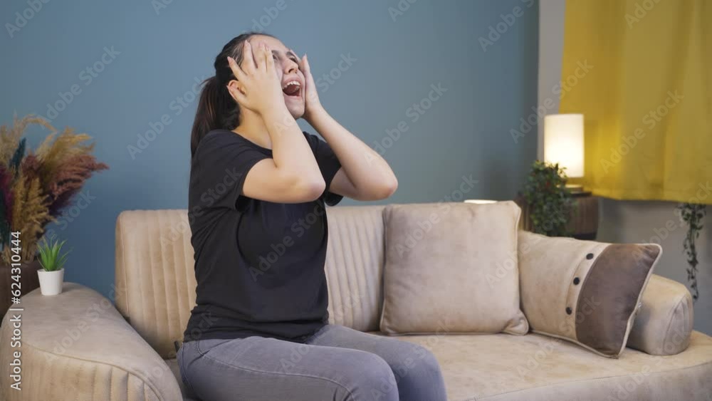 The young woman is shouting in anger at home. The young woman is shouting in anger at home.