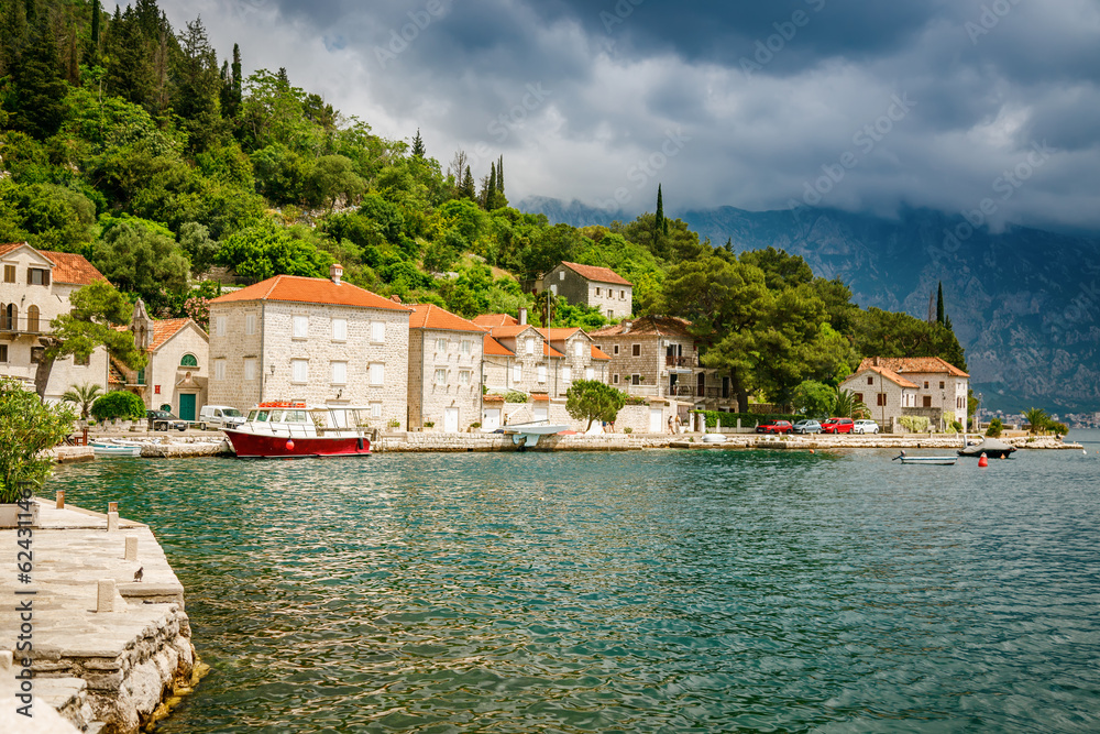 Small old stone houses on the embankment of Perast village in Boka Kotor bay