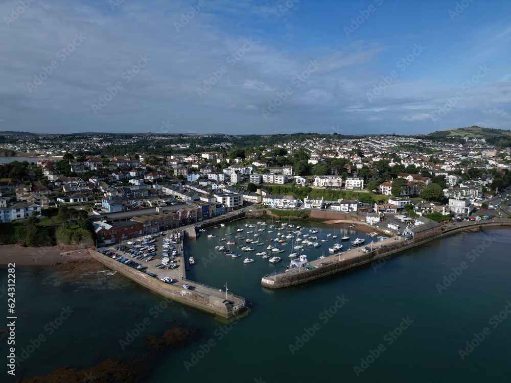 Paignton, Torbay, South Devon, England: DRONE VIEW: The drone photo shows Paignton Harbour and its entrance, the sea and the town of Paignton in the background.
