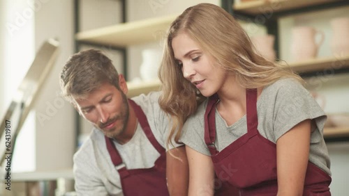Wallpaper Mural Family creativity, pottery workshop, young couple potters makes a pitcher out of clay, handicraft, production of handmade tableware. Torontodigital.ca