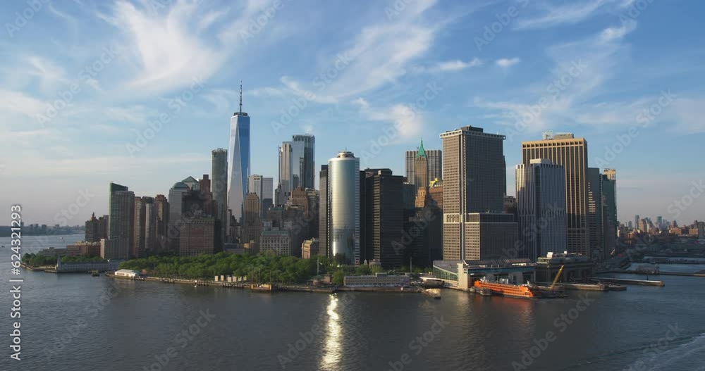 Fly-By Panorama Around the Wall Street Financial District in New York City, USA. Aerial Footage with Office Buildings and Skyscrapers on a Summer Sunny Day with Blue Sky and Light Clouds Fly-By Panorama Around the Wall Street Financial District in New York City, USA. Aerial Footage with Office Buildings and Skyscrapers on a Summer Sunny Day with Blue Sky and Light Clouds