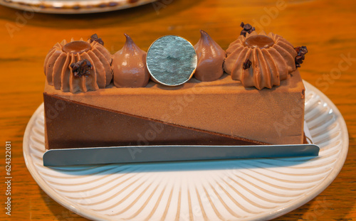 Fotografie Delicious Lucien chocolate cake on a white plate