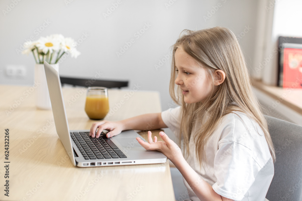 girl having video call in remote class with teacher using laptop, kid greeting with tutor, learning online on computer, home learning concept. Programming
