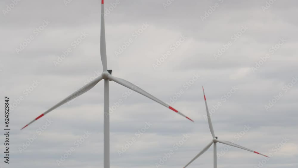 Wind turbine having with large vaned wheel rotated by wind to generate electricity. Wind turbine having with large vaned wheel rotated by wind to generate electricity.