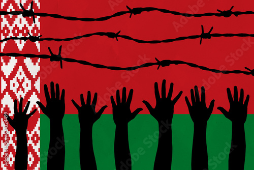 Belarus flag behind barbed wire fence. Group of people hands. Freedom and propaganda concept