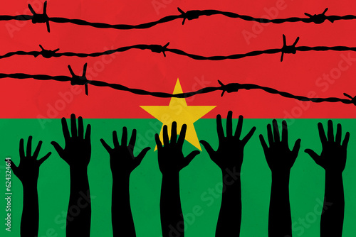 Burkina Faso flag behind barbed wire fence. Group of people hands. Freedom and propaganda concept