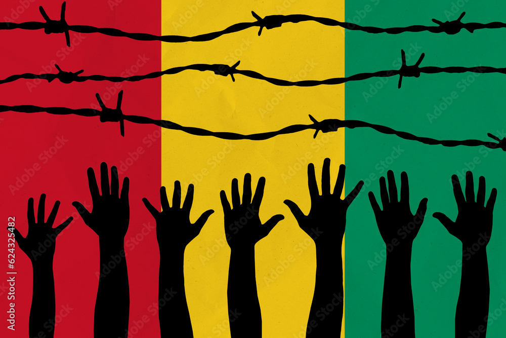 Guinea flag behind barbed wire fence. Group of people hands. Freedom and propaganda concept