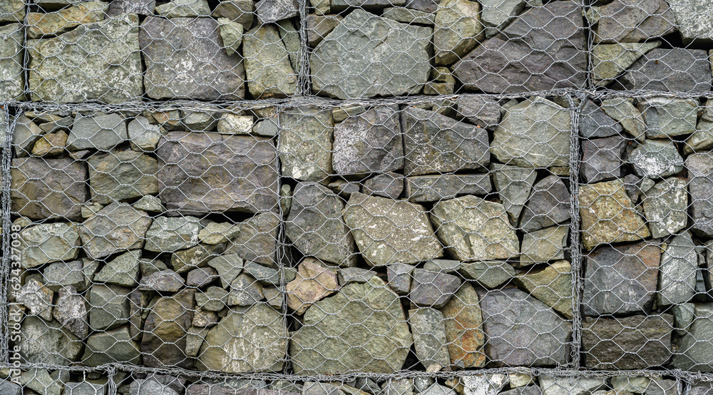 Obraz premium Stones covered with metal mesh.