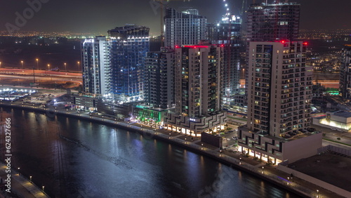 Towers at the Business Bay aerial day to night timelapse in Dubai, United Arab Emirates