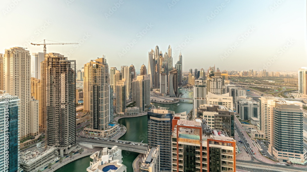 Obraz premium Panorama showing various skyscrapers in tallest recidential block in Dubai Marina aerial timelapse