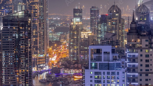 Dubai Marina and Media City districts with modern skyscrapers and office buildings aerial day to night timelapse. © neiezhmakov