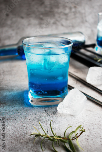 A glass of cocktail, Blue Lagoon. cool. on a gray background