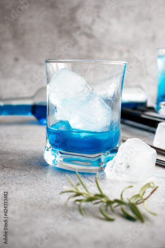 A glass of cocktail, Blue Lagoon. cool. on a gray background