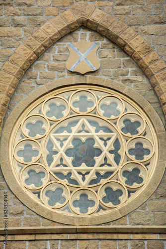 The rose window with David Star on the Gothic Revival style Roman Catholic Cathedral of Saint Andrew in Little Rock, Arkansas, United States