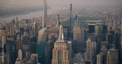 Aerial Footage of New York City and Manhattan Panoramic Cityscape with Empire State Building. Helicopter View of the Tourist Attraction with Central Park and Hudson River in the Background