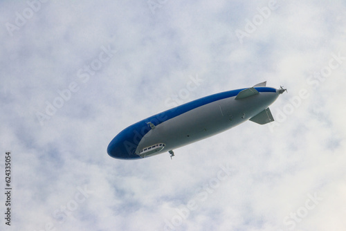Blimp, airship or dirigible flying in sky