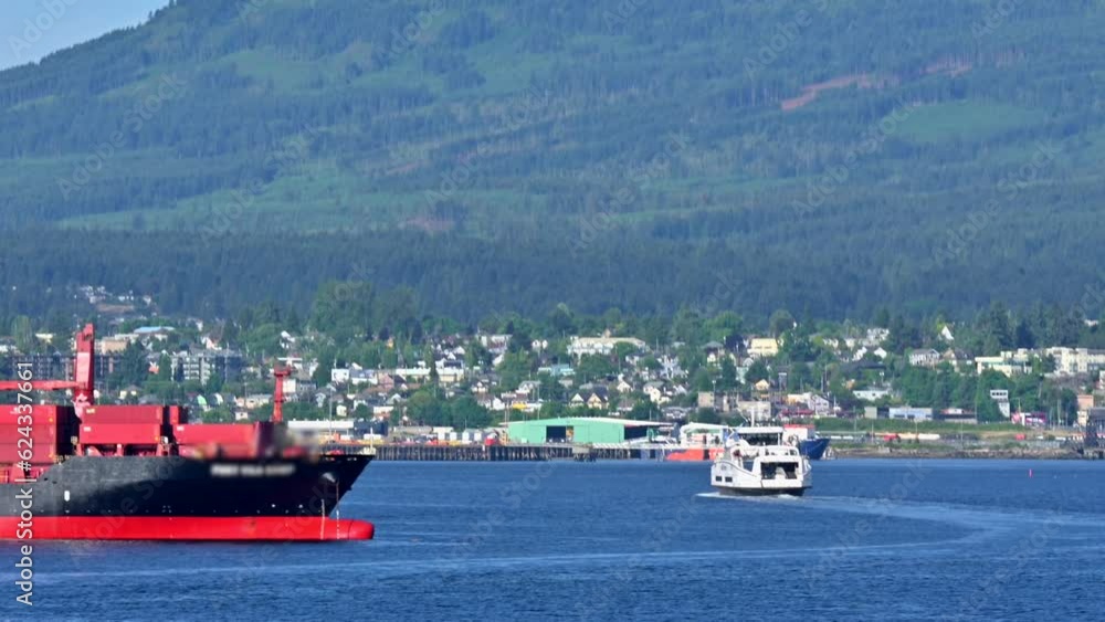 Industrial Hub: Duke Point B's Container Ships with Nanaimo's Cityscape Industrial Hub: Duke Point B's Container Ships with Nanaimo's Cityscape