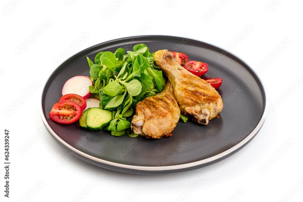 Grilled chicken with vegetables, isolated on white background.