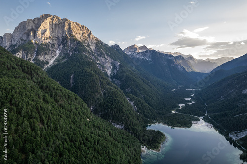Predil Lake and Alpine mountains landscape in Italy. Aerial drone view