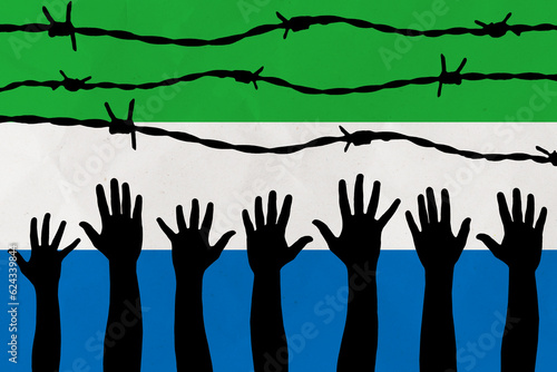 Sierra Leone flag behind barbed wire fence. Group of people hands. Freedom and propaganda concept