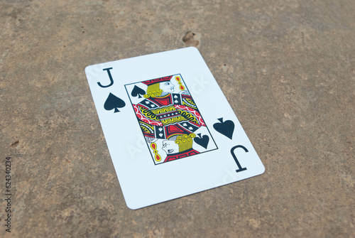 Poker card on concrete joker