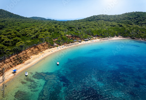 Fototapeta Naklejka Na Ścianę i Meble -  Mantraki beach with emerald sea and lush pine tree forrest at the island of Skiathos, Sporades, Greece