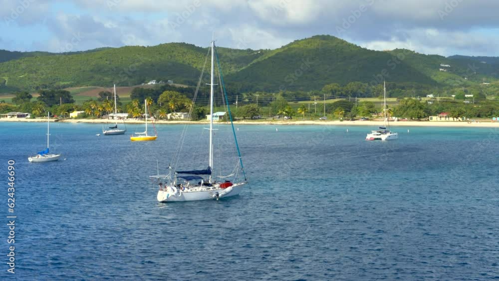 Saiboats docked in bay via anchor. No people static shoot Saiboats docked in bay via anchor. No people static shoot