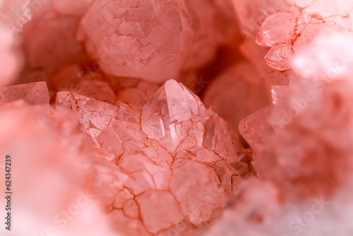 artificially pink dyed quartz geode detail.  macro detail texture background. close-up raw rough unpolished semi-precious gemstone photo