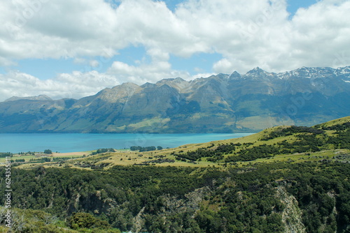 turquoise water nest underneath the Fiordland mountains in the trail around Queenstown New Zealand